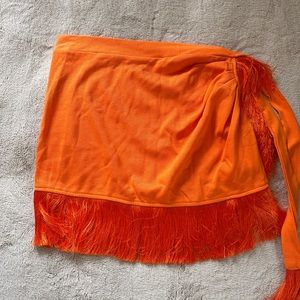 Women’s orange fringe skirt. Never worn. New with tags
